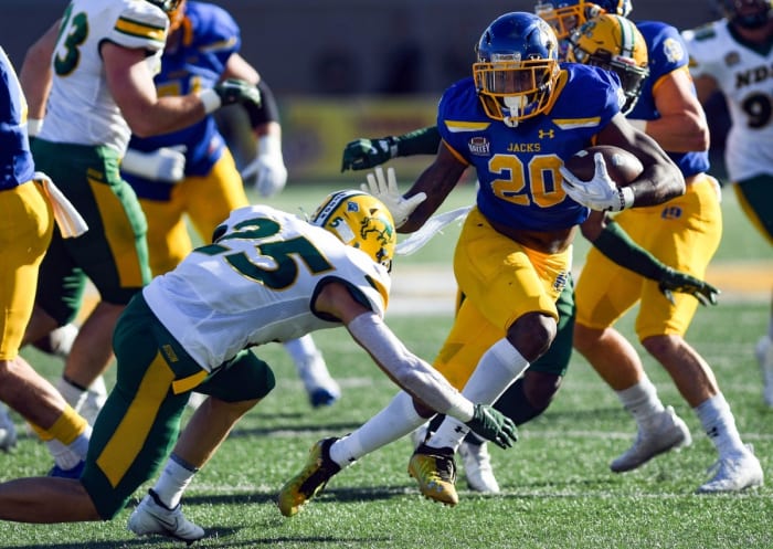 South Dakota State's Pierre Strong, Jr. avoids a tackle by North Dakota State's Michael Tutsie. Erin Woodiel / Argus Leader / USA TODAY NETWORK
